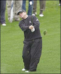 Ian Woosnam plays his second shot at the second hole