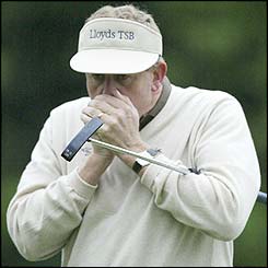 Colin Montgomerie struggles in the chilly conditions at Augusta