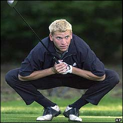 Amateur Ricky Barnes stretches on the second hole as he resumes his second round 