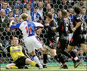 Damien Duff scores for Blackburn past grounded Charlton keeper Dean Kiely