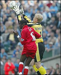 Middlesbrough forward Joseph Desire-Job puts pressure on Manchester City keeper Peter Schmeichel