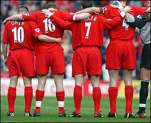Liverpool's players observe a minute's silence for the victims of the Hillsborough disaster