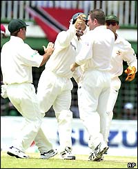 Spinner Stuart MacGill of Australia celebrates taking the wicket of Wavell Hinds for seven