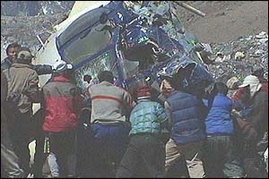 Rescuers around helicopter