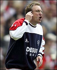 Neil Warnock urges his side forward in the second half at Old Trafford