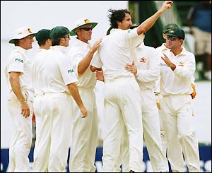 The Australia team celebrate as the West Indies' innings is over with Jermaine Lawson out for a duck