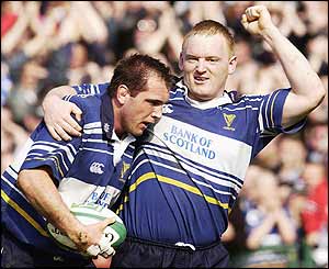 Keith Gleeson is congratulated by team-mate Leo Cullen after scoring Leinster's first try