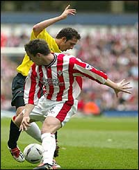 Watford's Michael Chopra and Southampton's Matt Oakley tussle for the ball