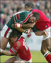 Leicester captain Martin Johnson battles to try and gain ground 
