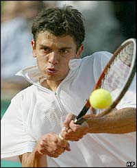 Croatia's Mario Ancic hits a forehand 