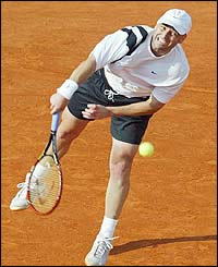 Andre Agassi hits a serve