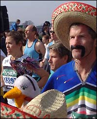Runners cross the start line of the race