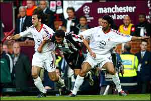 Andrea Pirlo and Rui Costa squeeze Alessandro del Piero 