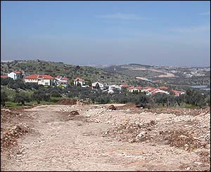 Israeli excavation stretching to the horizon and passing the settlement of Sharah Tikva