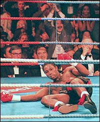 Lennox Lewis is knocked out in the second round by Oliver McCall