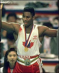 Lennox Lewis celebrates after receiving the gold medal during the 1988 Olympics Games