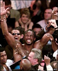 In a rematch against Holyfield Lewis wins the undisputed world title