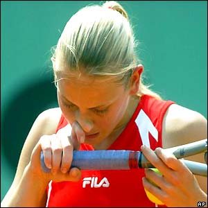 Jelena Dokic scratches her nose 