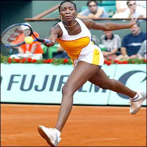 Venus Williams stretches to play a forehand
