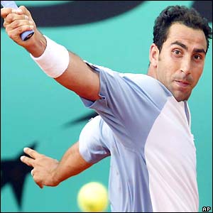 Albert Costa plays a backhand