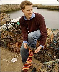 Prince William prepares to put on his wellies