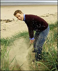 William practises his golf swing
