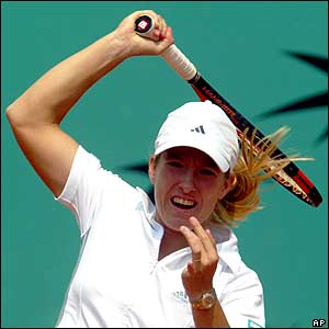 Belgium's Justine Henin-Hardenne returns the ball to Madagascar's Dally Randriantefy 