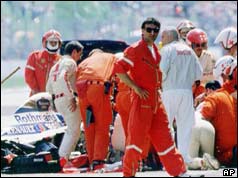Medics attend to Ayrton Senna after the accident