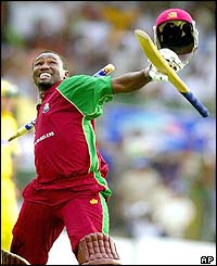 West Indies' Wavell Hinds punches ten air after reaching a century