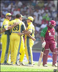 Australia's players congratulate each other after capturing the wicket of West Indies captain Brian Lara