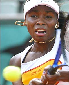 Venus Williams plays a shot against Silva Farina Elia