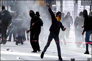 Rioters throw missiles