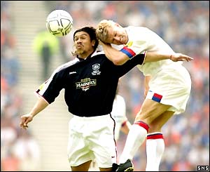 Artur Numan (right) challenges Fabian Caballero in the air