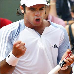 Chile's Fernando Gonzalez celebrates victory in the third round