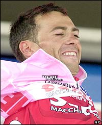 Italy's Gilberto Simoni proudly wears the pink jersey