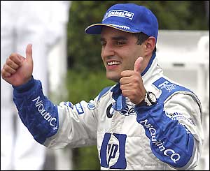 Juan Pablo Montoya give two thumbs up the crowd after winning
