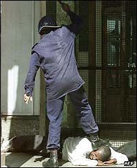 Policeman beating a protester