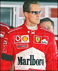 Michael Schumacher wears a black armband after the death of his mother