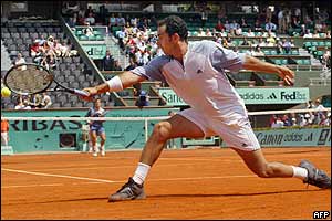Spain's Albert Costa returns the ball to compatriot Tommy Robredo