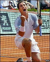 Spain's Albert Costa jubilates after he defeated his compatriot Tommy Robredo 