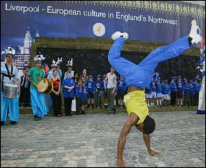 A street performer celebrates Liverpool's new status