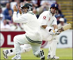 Mark Butcher strikes the ball past a fielder and through the leg side
