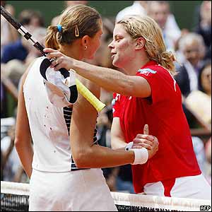 Nadia Petrova is consoled by her opponent after losing to Belgium's Kim Clijsters