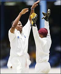 Dillon and Carlton Baugh celebrate as Ricky Ponting is removed for 45