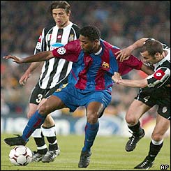 Barcelona's Patrick Kluivert is held back by Juventus' Uruguayan player Paolo Montero