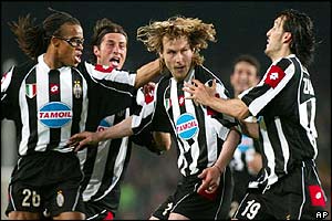 Juventus' Pavel Nedved is congratulated by team mates after scoring against Barcelona 