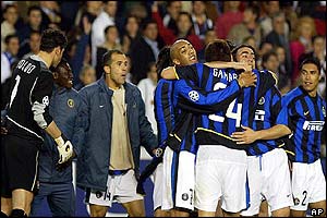 Inter Milan's players celebrate beating Valencia on away goals