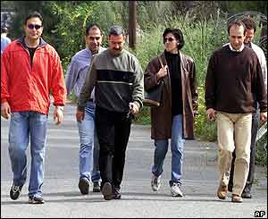 Group of Turkish Cypriots walk to south