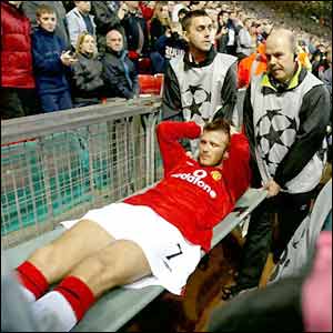 David Beckham is stretchered off against Deportivo La Coruna in March 2002