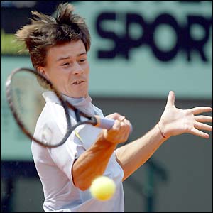 Argentina's Guillermo Coria strikes a forehand return